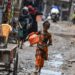 A Rohingya girl walks through a refugee camp in Delhi.