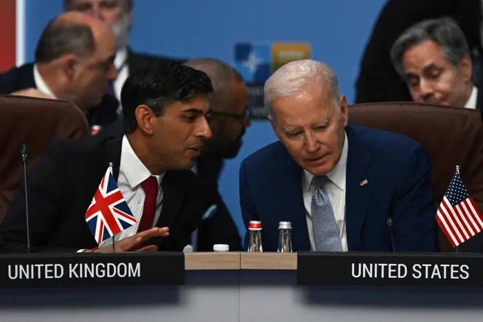 British prime minister Rishi Sunak and US president Joe Biden speak at the start of the meeting of the North Atlantic Council NAC during the Nato Summit