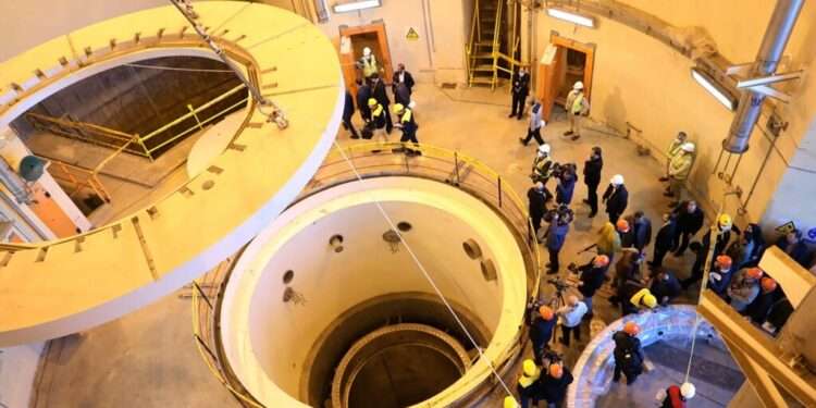 Tehran Answers UN Inspectors Over Found Manmade Uranium Residues 1 Technicians work at the Arak heavy water reactor's secondary circuit, as IAEA officials and media visit the site.