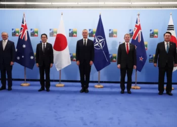 Beijing Warns Of Any NATO Expansion In Asia 2 Leaders from Asia pose for a group photo with NATO Secretary General Jens Stoltenberg in Vilnius.