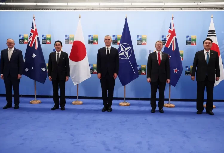 Leaders from Asia pose for a group photo with NATO Secretary General Jens Stoltenberg in Vilnius.