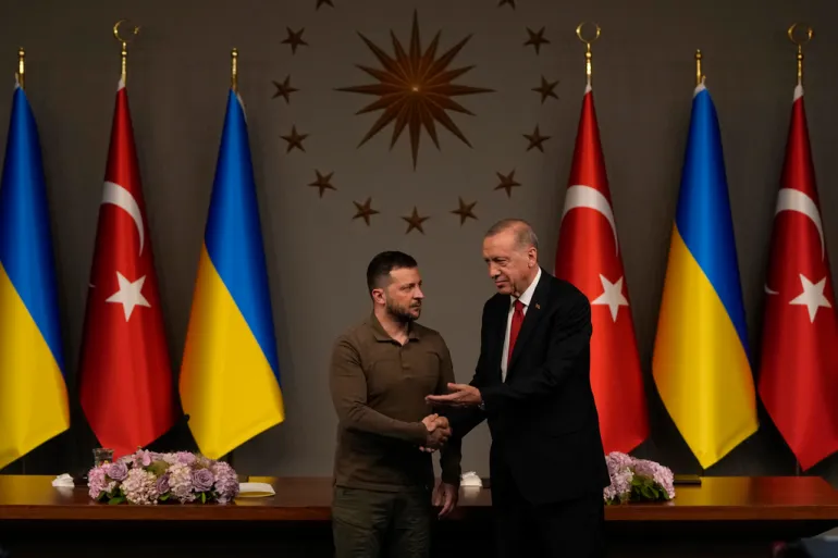 Turkish President Recep Tayyip Erdogan right shakes hands with Ukrainian President Volodymyr Zelenskyy left