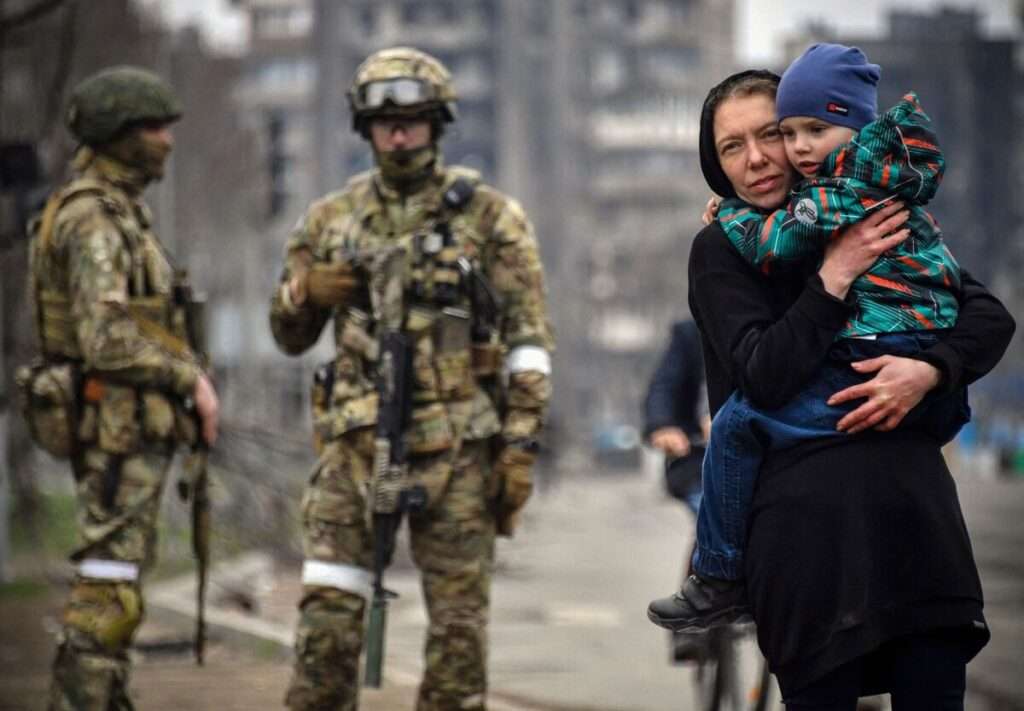 Ukrainian mother carrying her child