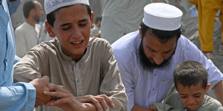 Pakistan Carries Out Burials As Death Toll From Rally Bomb Explosion Rises To 54 1 Boys weep over the death of a family member at a funeral a day after bomb blast in the Bajaur district of Pakistan's Khyber-Pakhtunkhwa province targeted a political rally, July 31, 2023.