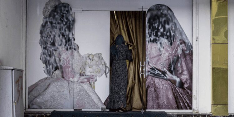 A woman enters a beauty salon in Kabul. The Taliban recently banned women's beauty salons.