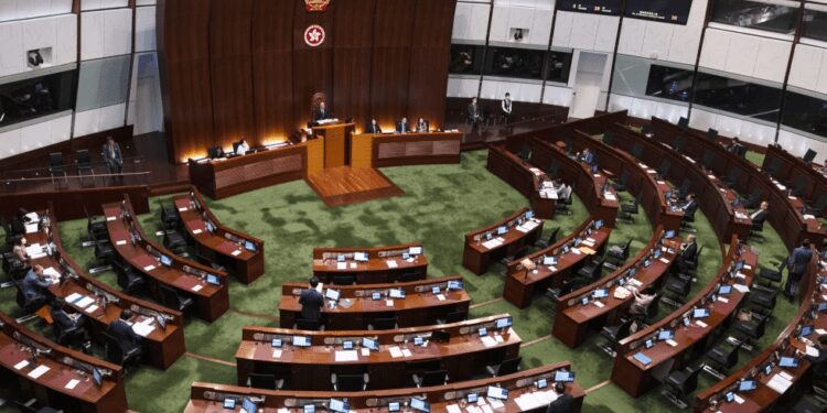 Hong Kong Amends Law To Reduce Directly Elected Council Seats 1 Pro-China lawmakers attend the second reading of a bill that will overhaul district council elections in Hong Kong.