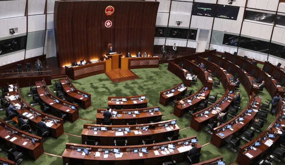 Pro-China lawmakers attend the second reading of a bill that will overhaul district council elections in Hong Kong.