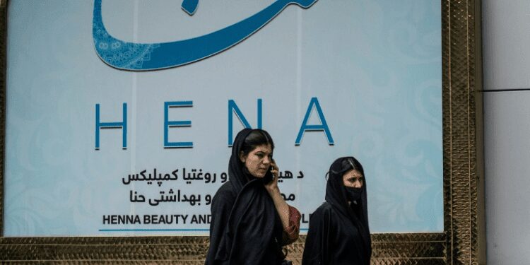 Taliban Orders Closure Of Beauty Salons In Afghanistan As Deadline Comes To An End 1 Women walk past a beauty salon in the Shahr-e-Naw area of Kabul ahead ahead of the order for beauty parlours across the country to shut permanently.