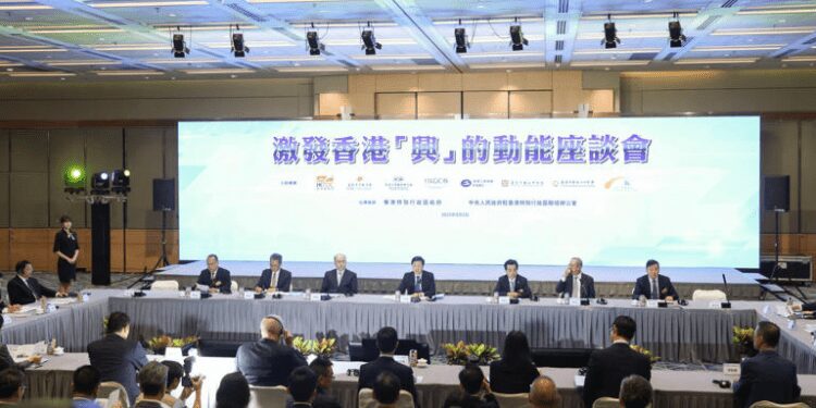 Hong Kong Will Be Able To Scale New Heights- Chief Executive John Lee 1 Chief Executive John Lee (centre); Zheng Yanxiong, the director of the central government's liaison office in the city third from left) at a symposium designed to help boost the economy.