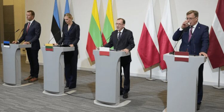 From left, Estonia's Interior Minister Lauri Laanemets, Lithuania's Interior Minister Agne Bilotaite, Poland's Interior Minister Mariusz Kaminski, and Latvia's Interior Minister Maris Kucinskis speak to reporters following talks in Warsaw, Poland, Monday, Aug. 28, 2023.