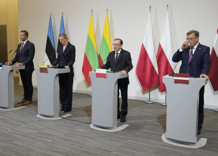From left, Estonia's Interior Minister Lauri Laanemets, Lithuania's Interior Minister Agne Bilotaite, Poland's Interior Minister Mariusz Kaminski, and Latvia's Interior Minister Maris Kucinskis speak to reporters following talks in Warsaw, Poland, Monday, Aug. 28, 2023.