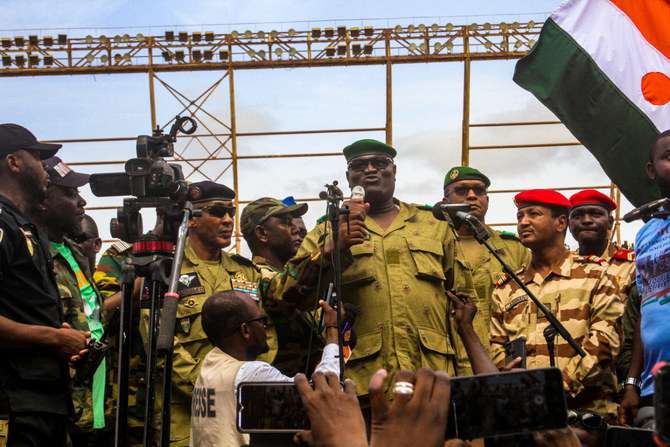 Members of a military council that staged a coup in Niger attend a rally at a stadium in Niamey Niger