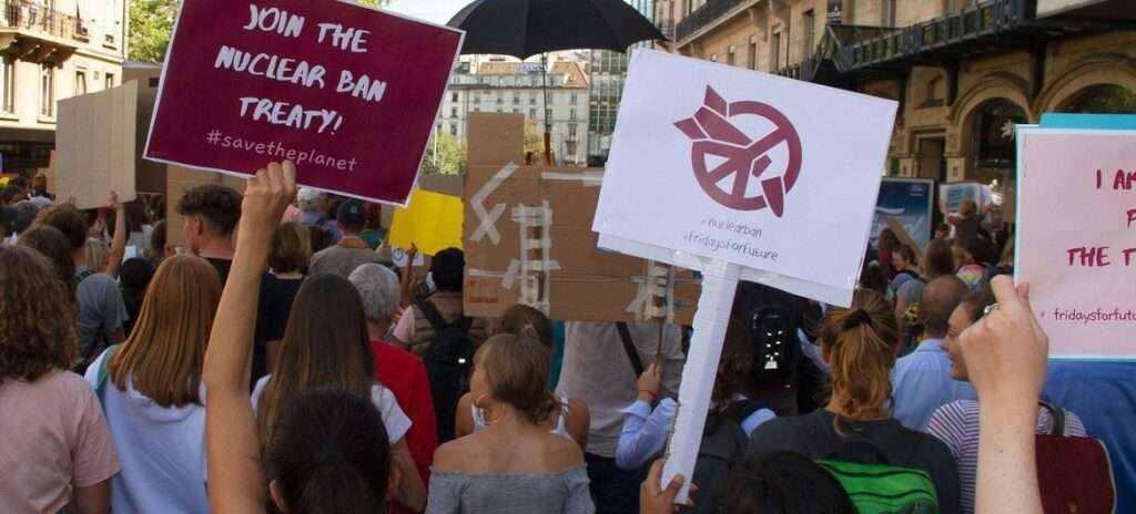 People protest against nuclear weapons at a worldwide climate strike in Geneva