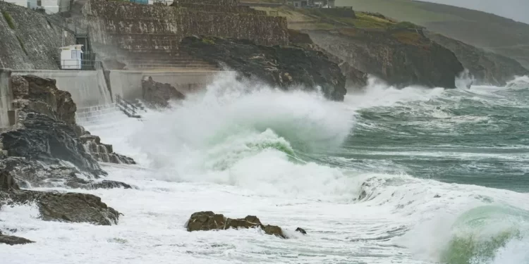 Heavy rain in Northern Ireland and violent storms in the south-wests of England and Wales are predicted amid amber alerts.