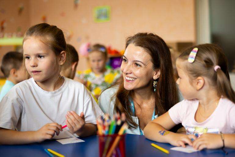 UNICEF Regional Director for Europe and Central Asia Regina De Dominicis speaks with preschool children