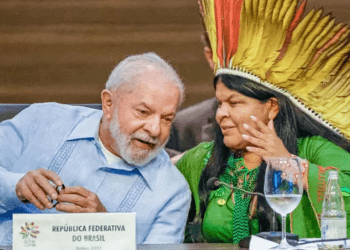 Luiz Inácio Lula da Silva, the President of Brazil, speaks to his minister of Indigenous peoples, Sonia Guajajara, at the Amazon summit.