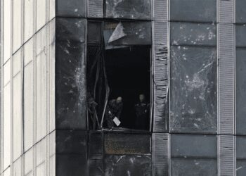 Three Unmanned Aerial Vehicles Downed In Moscow Region 1 People inspect the damage sustained to a building of the Moscow International Business Centre (Moskva City) following a drone attack in Moscow on August 23, 2023.