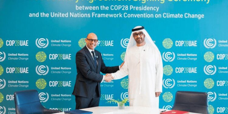 Space Made Available For Climate Activists To “Make Their Voices Heard” At COP28 1 The UAE's Minister of Industry and Advanced Technology and COP28 President-designate Sultan bin Ahmed Al-Jaber, right, and the United Nations Framework Convention on Climate Change (UNFCCC) Executive Secretary Simon Stiell during a signing ceremony of the Host Country Agreement in Abu Dhabi, on August 1, 2023.