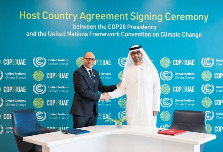 Space Made Available For Climate Activists To “Make Their Voices Heard” At COP28 1 The UAE's Minister of Industry and Advanced Technology and COP28 President-designate Sultan bin Ahmed Al-Jaber, right, and the United Nations Framework Convention on Climate Change (UNFCCC) Executive Secretary Simon Stiell during a signing ceremony of the Host Country Agreement in Abu Dhabi, on August 1, 2023.