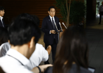 Japanese Prime Minister Fumio Kishida answers questions from journalists upon his arrival at the prime minister's office on Tuesday, Aug. 22, 2023, in Tokyo.