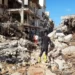 Members of Libyan Red Crescent work in an area affected by flooding in Derna.