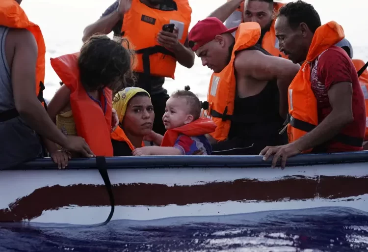 Over 2,500 People Found Dead Or Missing In Attempts To Cross The Mediterranean 1 Eighteen people on a small wooden boat near the Italian island of Lampedusa, in the Mediterranean Sea, in 2021.