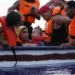 Eighteen people on a small wooden boat near the Italian island of Lampedusa, in the Mediterranean Sea, in 2021.