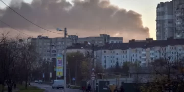 In this image from November 2022, smoke rises over Lviv city after a Russian aerial attack.