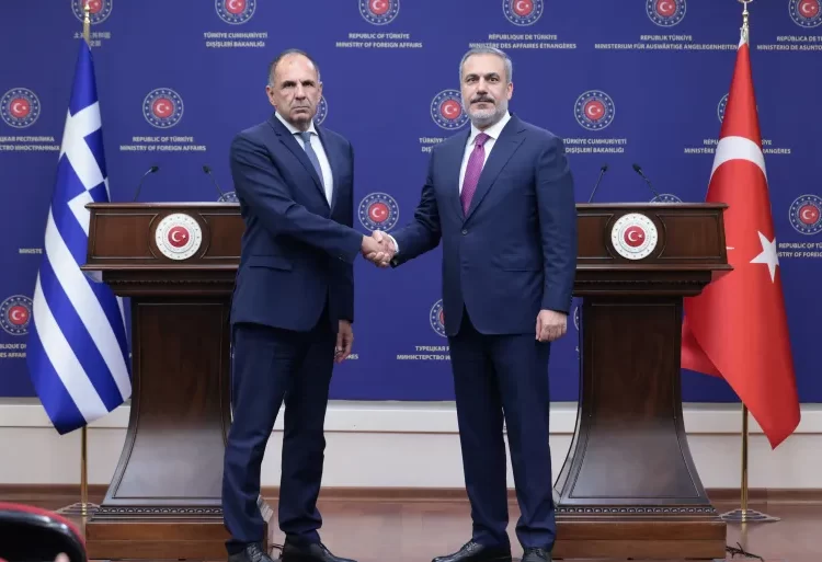 Turkish Foreign Minister, Hakan Fidan shakes hands with his Greek counterpart, George Gerapetritis during a news conference in Ankara, Turkey.