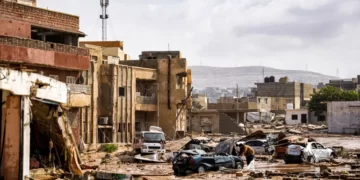 Destroyed vehicles and damaged buildings in the eastern city of Derna, about 290 kilometres (180 miles) east of Benghazi.