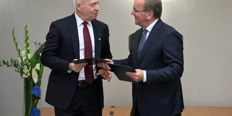 Germany And Israel Ink $3.5bn Missile Shield Deal 1 German Defence Minister Boris Pistorius (R) and Israeli Defence Minister Yoav Gallant exchange documents.