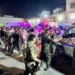 Soldiers and emergency responders gather around ambulances carrying wounded people after a fire at a wedding in Iraq’s Nineveh province.