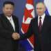 Kim Jong Un and Vladimir Putin shake hands as they begin their talks at the Vostochny Cosmodrome.