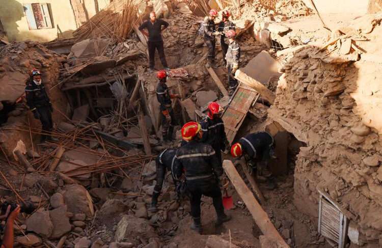 EU Donates €1 Million To Morocco 1 Rescuers search through wreackage for survivors.