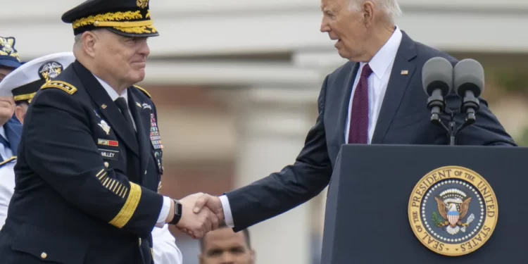President Joe Biden, right, shakes hands with outgoing Joint Chiefs Chairman Gen. Mark Milley, during an Armed Forces Farewell Tribute in honor of Milley at Joint Base Myer–Henderson Hall, Friday, Sept. 29, 2023, in Fort Meyer.