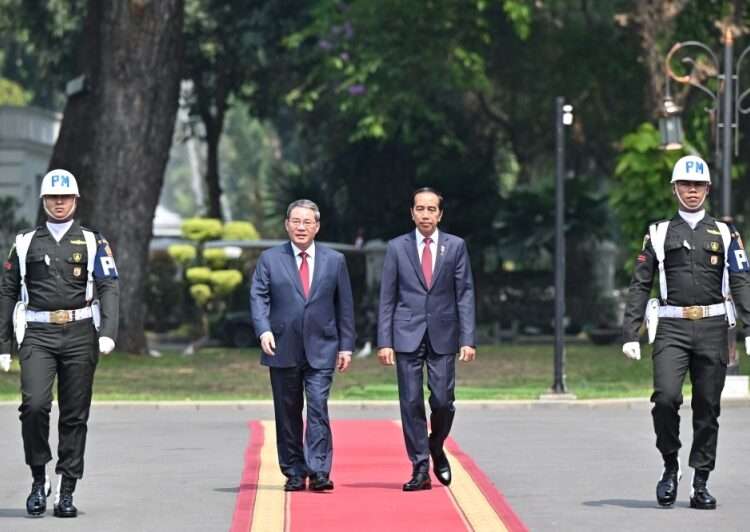 China Pledges $21.7 Billion Investment In Indonesia 1 China's Premier Li Qiang (centre left) and Indonesia's President Joko Widodo (centre right).