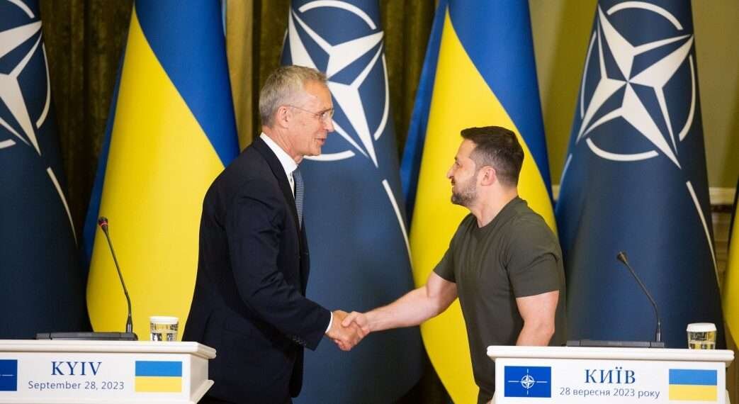 NATO Secretary General, Jens Stoltenberg, left, shakes hands with President Volodymyr Zelenskyy.