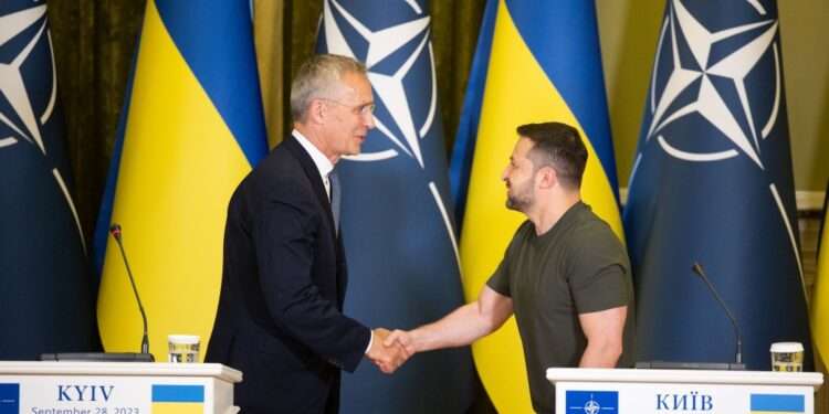 NATO Secretary General, Jens Stoltenberg, left, shakes hands with President Volodymyr Zelenskyy.