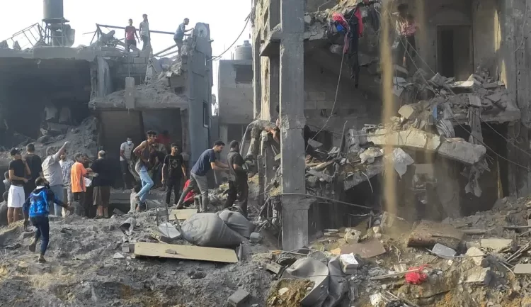Israel Kills Hamas Commander In Jabalia Strike 1 Palestinians conduct search and rescue works at the site of Israeli strikes on houses in Jabalia refugee camp in the northern Gaza Strip.