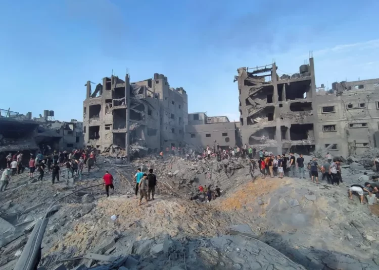 Jabalia Camp Reduced To Rubble 1 Palestinians search for casualties at the site of Israeli strikes on houses in Jabalia refugee camp in the northern Gaza Strip.