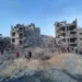 Palestinians search for casualties at the site of Israeli strikes on houses in Jabalia refugee camp in the northern Gaza Strip.