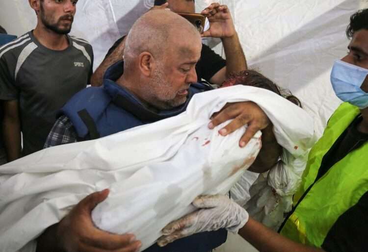 Lured To Death By Illusion Of Safety 1 Wael Dahdouh mourns over the body of his seven-year-old daughter, who was killed along with his wife and son in an Israeli air raid in the Nuseirat refugee camp.