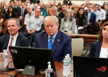 Former  U.S President, Donald Trump sits between his lawyers, Christopher M. Kise and Alina Habba.