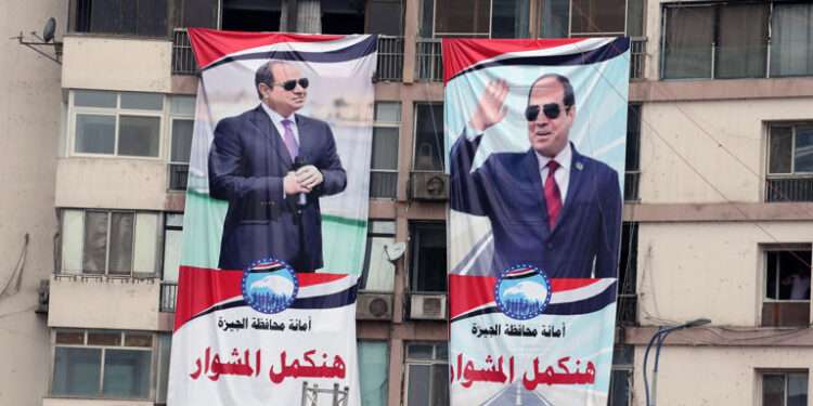 Banners with pictures of Egyptian President Abdel Fattah El Sisi.