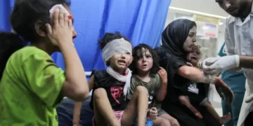 Palestinian children wounded in Israeli air raids are brought to al-Shifa Hospital in Gaza City.