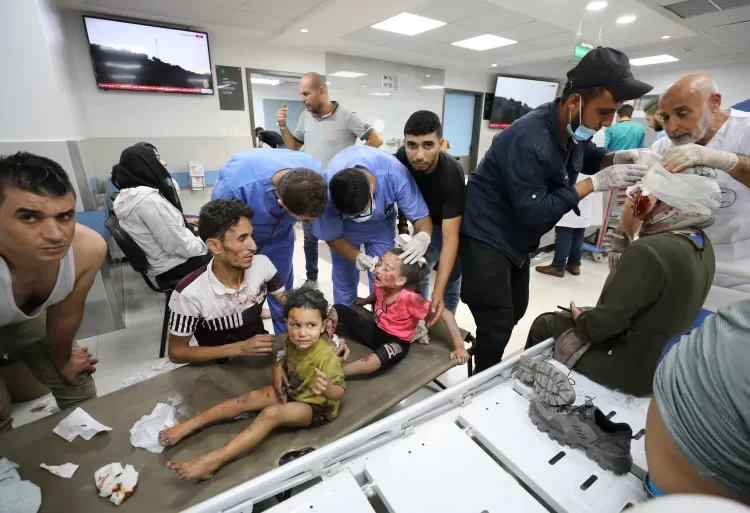 Palestinian children wounded in Israeli air attacks are brought to al-Shifa Hospital in Gaza City.