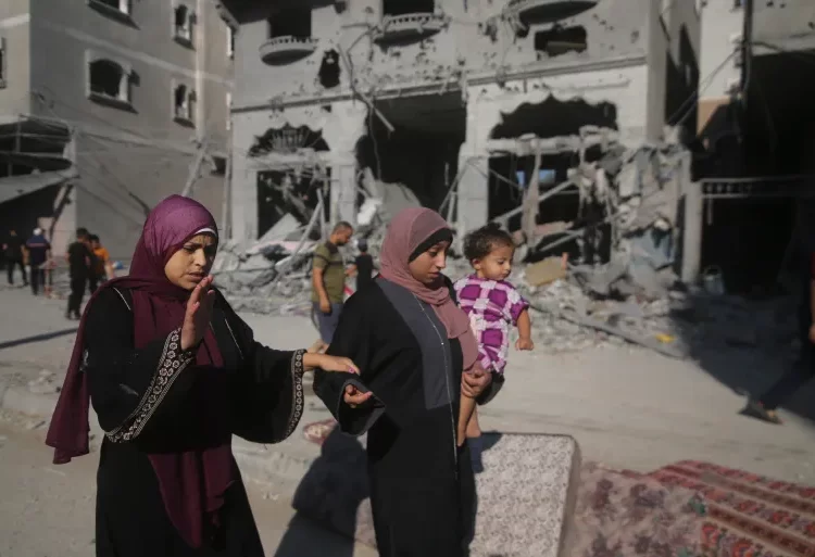 Israel Orders Palestinians To Evacuate To Southern Gaza 1 Palestinians leave their houses following Israeli airstrikes in Rafah refugee camp, southern Gaza.
