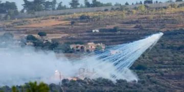 A shell fired by Israeli artillery explodes over a house in al-Bustan, a Lebanese border village with Israel, south Lebanon.