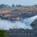 A shell fired by Israeli artillery explodes over a house in al-Bustan, a Lebanese border village with Israel, south Lebanon.