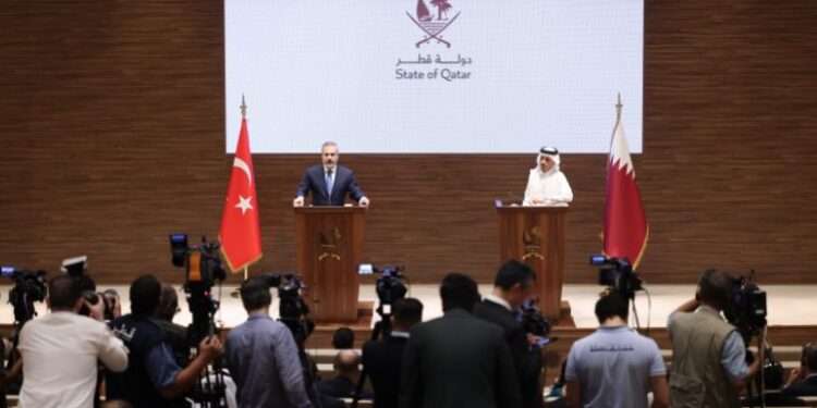 Turkish Foreign Minister Hakan Fidan (L) and Prime Minister and Minister of Foreign Affairs of Qatar, Mohammed bin Abdulrahman bin Jassim Al Thani (R) hold a joint press conference in Doha.